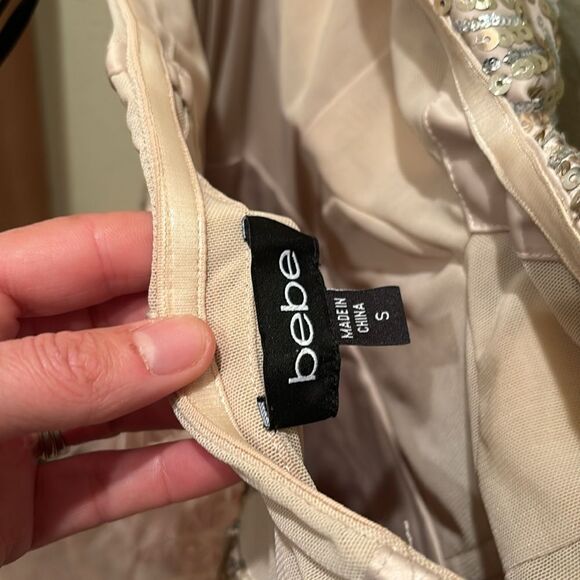 Bebe strapless fringe and sequin dress. Top is gold and the fringe is light pink - Picture 11 of 11